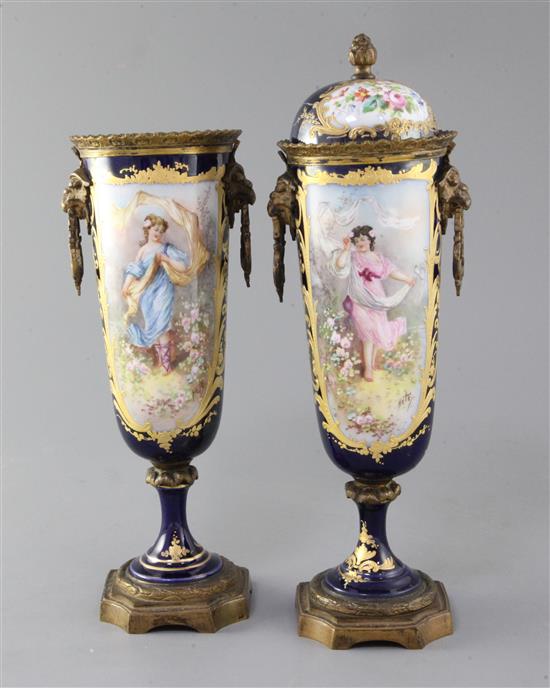 A pair of Sevres style porcelain and ormolu mounted vases and covers, c.1900, height 30cm, damage to covers